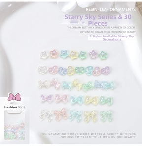 Macro detail of aurora resin nail art charms including stars hearts and bows in 30 pieces pack
