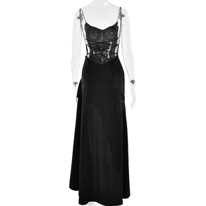 Detail of the black maxi dress featuring a crisscross lace-up back and backless design