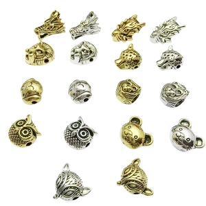 DIY Tibetan silver and gold animal head beads featuring lion, dragon, and fox designs