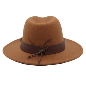 Detail of the brown fedora hat featuring a vintage leather belt band and bow knot