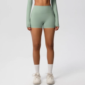 Close-up of high-waist mint green fitness shorts with elastic moisture-wicking fabric