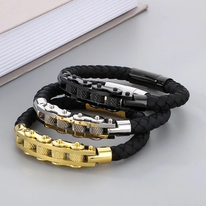 Detailed macro view showing braided leather cords with stainless steel link chains