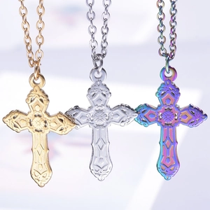 Three hollow cross pendants in gold, silver, and rainbow stainless steel with chains