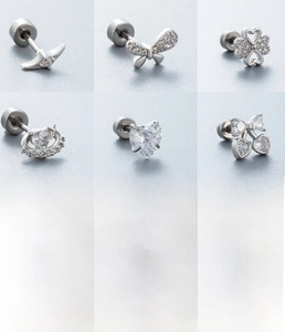 Detailed views of 0.8mm titanium steel stud earrings with zirconia clover and heart designs