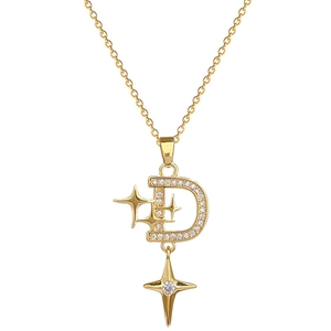 Luxurious gold D-letter starburst pendant necklace with sparkling zircons on white background