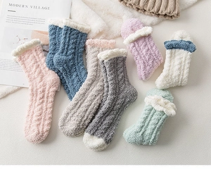 Close-up of soft coral fleece winter socks in multiple pastel colors with white cuffs