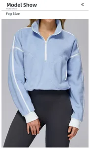Detail of blue fleece half-zip jacket with white stripes on collar and sleeves