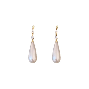 Elegant gold drop earrings with cubic zirconia and teardrop pearls on a white background