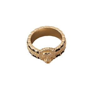 Vintage golden lion head ring with embossed texture and metal band on white background