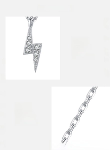 Macro view of 925 sterling silver lightning pendant featuring inlaid sparkling zircon