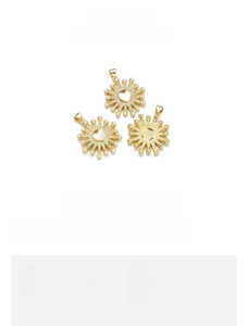 Detail view of heart-shaped evil eye pendant in 18K gold-plated copper with tiny shells