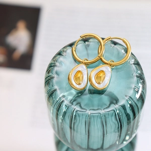 French style gold teardrop earrings with white mother of pearl inlay on green glass