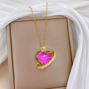 Luxurious titanium steel crown heart necklace with pink gemstone on jewelry box display