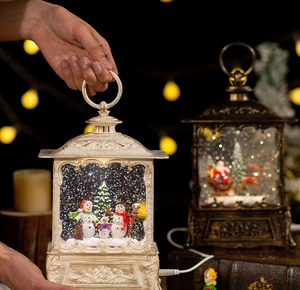 Close-up of vintage Christmas lanterns with glowing Santa and snowman family scenes