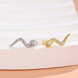 Micro pave cubic zirconia snake stud earrings in silver and gold minimalist finish