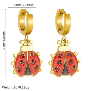 Detailed view of red ladybug earrings with dimensions 1.8cm x 3.5cm and 8g weight