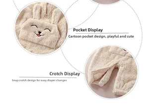 Detail of baby plush romper with bunny pocket and snap buttons for diaper change