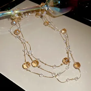 Elegant multi-layer French crystal beaded necklace with gold chain and amber facet beads