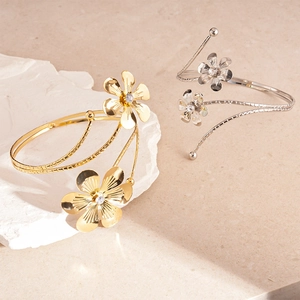 Metallic flower open cuff arm bracelets in gold and silver with sparkling crystals