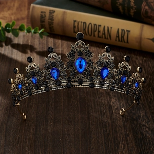 Detailed close-up of a vintage golden bridal crown with blue and black rhinestones