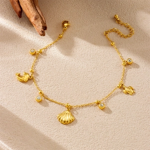 Gold-plated stainless steel anklet with dolphin, turtle, and shell charms and beads