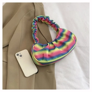 Detailed view of rainbow gradient ruched shoulder bag with a stylish cloud shape