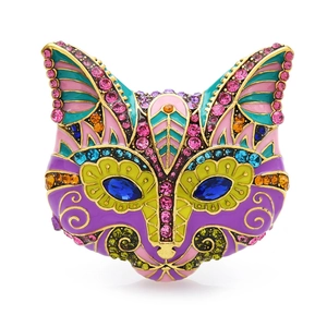Ornate vintage cat brooch with colorful enamel and sparkling rhinestones on gold alloy