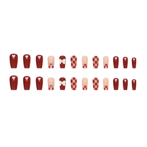 Short ballet press-on nails with red checkerboard pattern and bow heart accents
