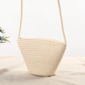 Detail of the woven cotton shell bag texture with a sturdy zipper and shoulder strap