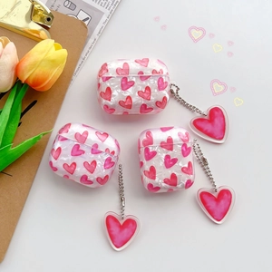 AirPods Pro case with pink heart patterns and pearlescent shell texture charms