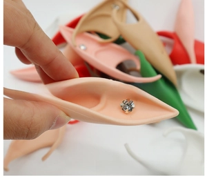 Detailed macro shot of colorful latex elf ears with embedded rhinestones for cosplay