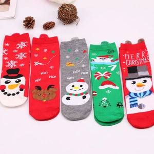 Five pairs of festive Christmas cotton socks featuring Santa and reindeer patterns