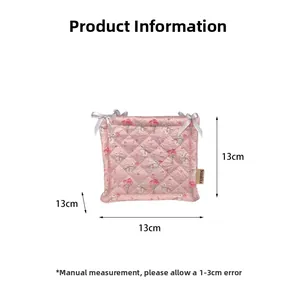 Detailed view of pink quilted fabric storage basket with 13cm dimensions and bow decoration
