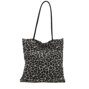 Large leopard print tote bag with black leather handles and golden metal eyelets
