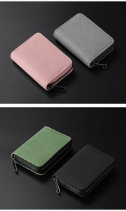 Close-up of velvet texture zipper card wallets in pink, grey, green and black colors
