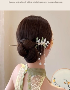 Detail of Lily of the Valley hair stick with white resin flowers and pearl chain tassel