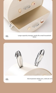 Macro view showing large storage capacity and chrome rabbit ear detail on desk organizer