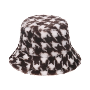 Close-up of houndstooth plush bucket hat showing thick faux rabbit fur texture