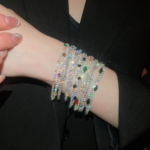 Stunning detail of luxury 18k gold plated stacked zircon tennis bracelets on wrist