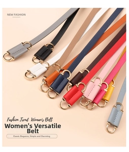 Selection of slim women's faux leather belts in twelve vibrant colors with gold D-rings