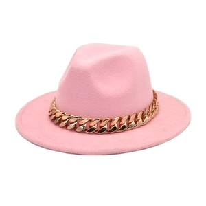Detail of the pink felt fedora hat featuring a stylish chunky gold metal chain band