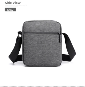 Rear view of grey Oxford cloth crossbody bag featuring a hidden back zipper pocket