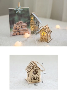 Detail view of a glowing wooden Christmas house hanging ornament with warm LED lights