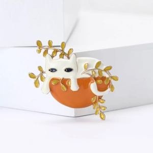 Cute lazy cat enamel brooch in white and orange with gold finish on white cube