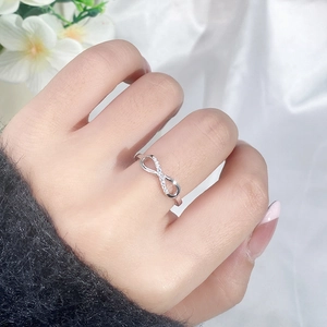 Elegant S925 sterling silver infinity ring with white cubic zirconia in a minimalist style