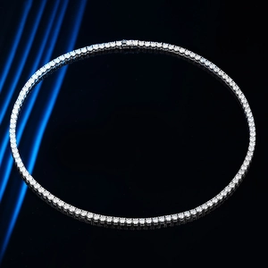 Luxury moissanite tennis necklace in sterling silver with round cut stones on dark background