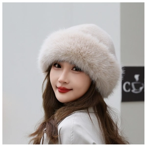 Close-up of thick beige faux fur winter hat showing plush texture and warm material