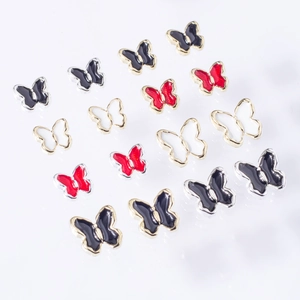 Charmants bijoux d'ongles en forme de papillon coloré avec cadre doré et émail