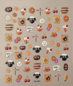 Detail of 3D embossed jelly nail stickers featuring cartoon sheep and ice cream motifs