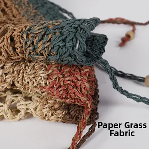 Macro detail of hand-woven paper straw fabric with retro drawstrings and wooden beads